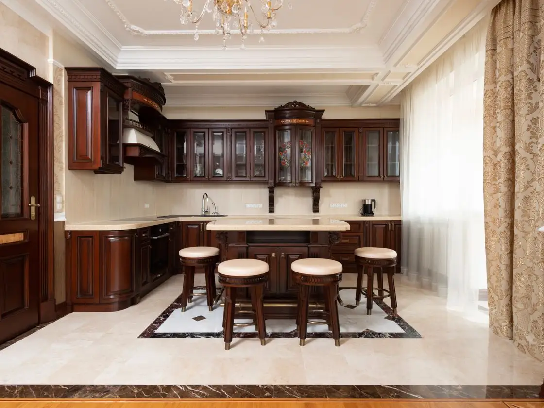 Bespoke handleless kitchen in a period Surrey home with warm dark cabinetry, aged-brass hardware and a large quartz island